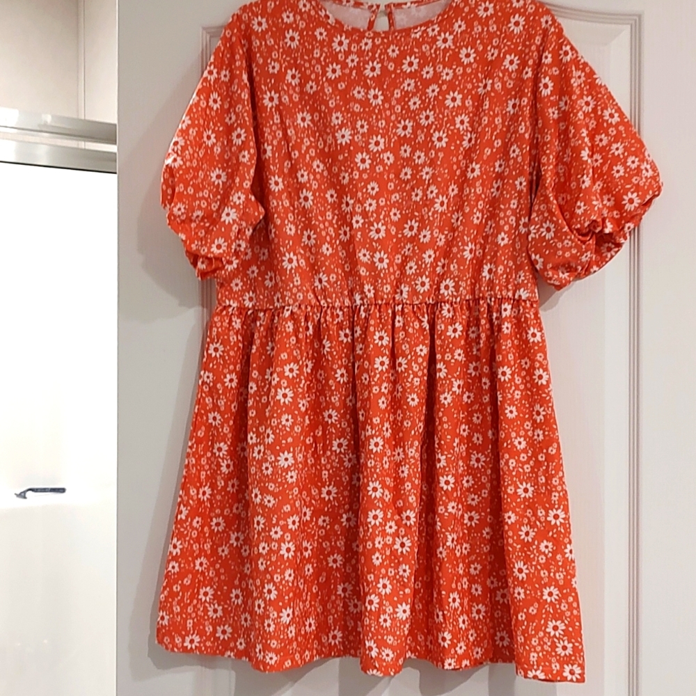 A light weight orange and white dress.